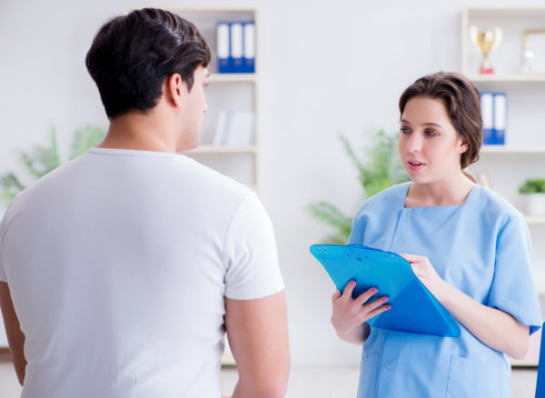 Patient visiting doctor for annual regular check-up in hospital clinic