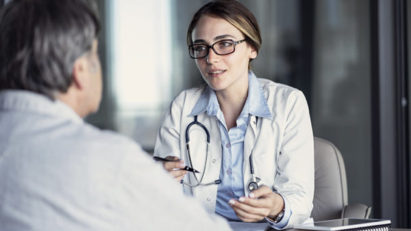 Doctor talking to the patient Doctor talking to the patient